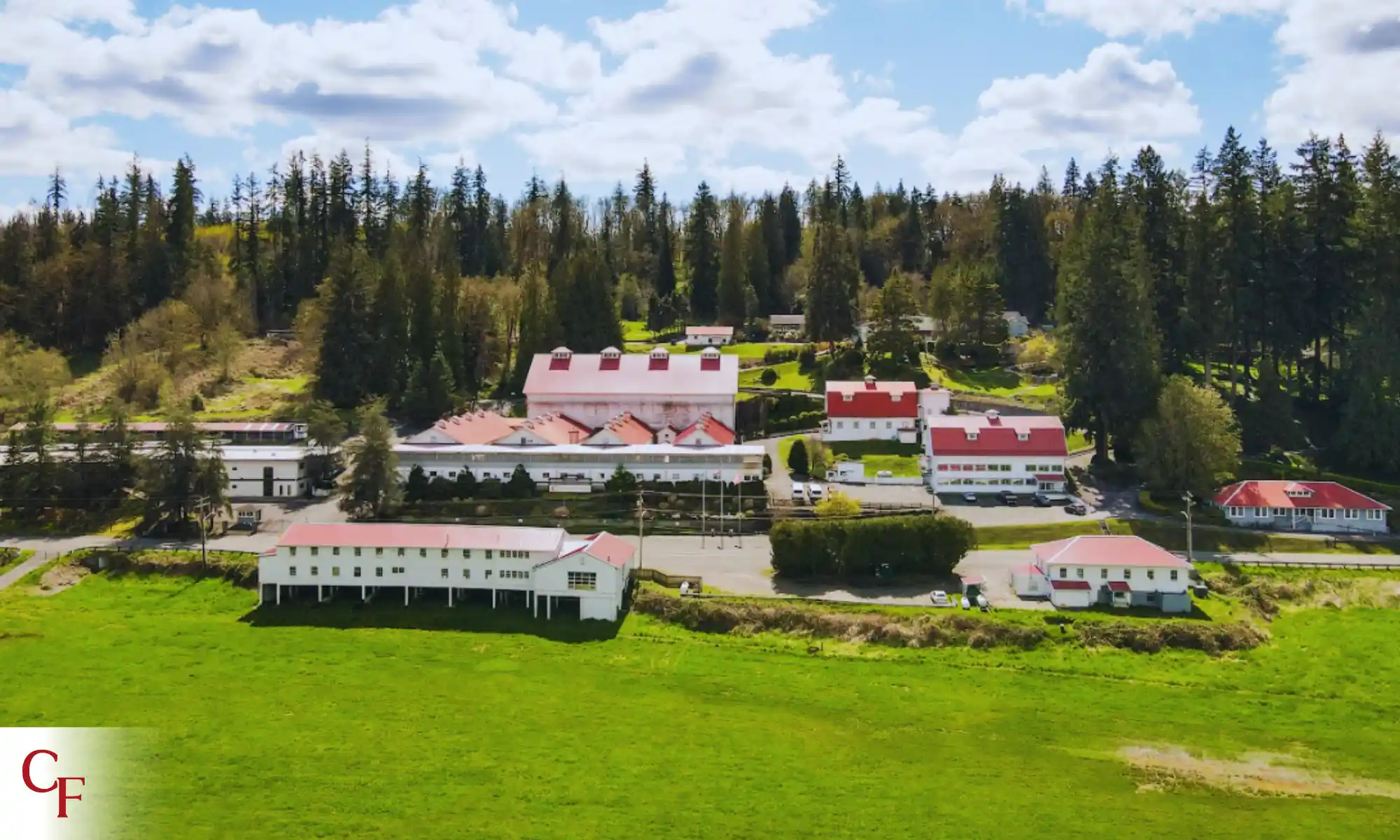 Aerial view of Carnation Farms buildings and surrounding green fields in the Snoqualmie Valley.